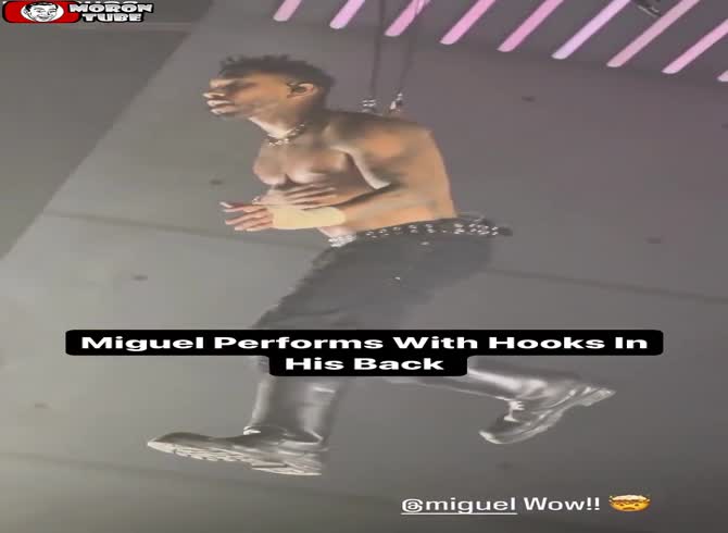 Video :During a live concert, a vocalist is suspended from hooks